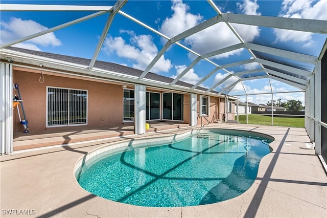 view of pool with a lanai and a patio area