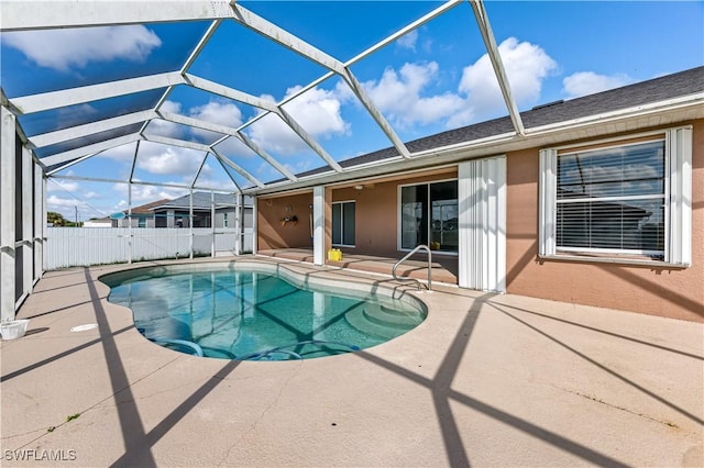 view of pool featuring a lanai and a patio