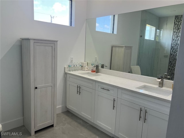 bathroom with vanity and a shower with shower door