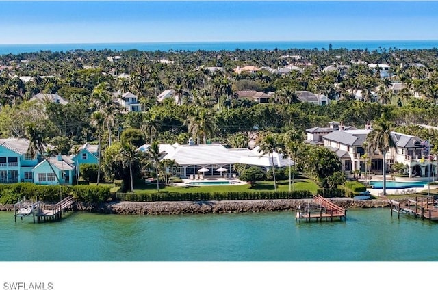 drone / aerial view featuring a water view and a residential view