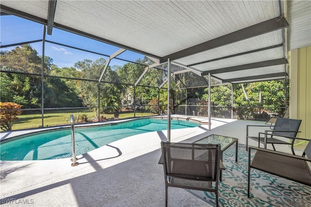 pool featuring a lanai and a patio area