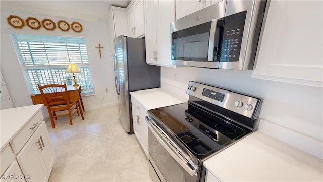 6082 National Blvd Unit 128, Ave Maria, FL 34142 - kitchen with stainless steel appliances and white cabinets