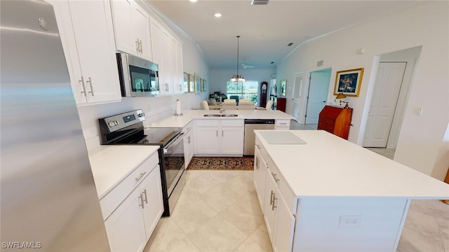 6082 National Blvd Unit 128, Ave Maria, FL 34142 - kitchen featuring pendant lighting, white cabinetry, sink, kitchen peninsula, and stainless steel appliances