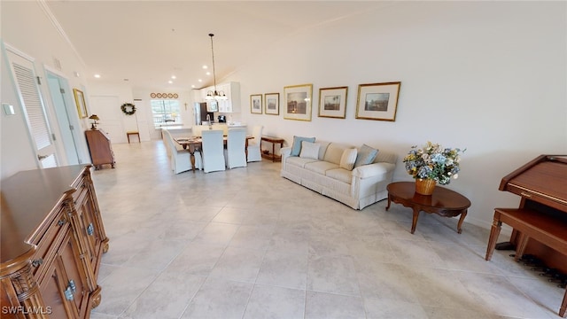 6082 National Blvd Unit 128, Ave Maria, FL 34142 - living room featuring vaulted ceiling