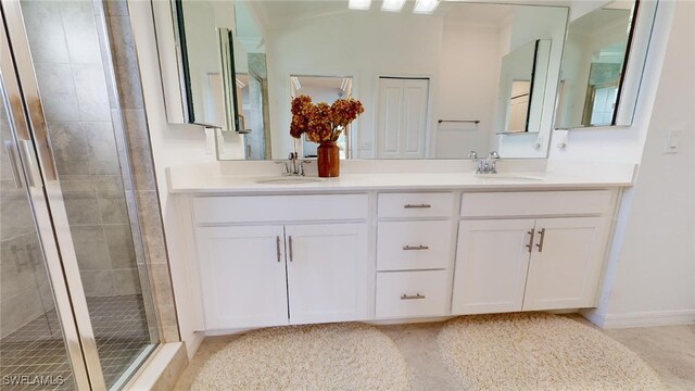 6082 National Blvd Unit 128, Ave Maria, FL 34142 - bathroom with crown molding, vanity, and an enclosed shower