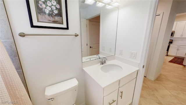 6082 National Blvd Unit 128, Ave Maria, FL 34142 - bathroom featuring tile patterned floors, vanity, and toilet