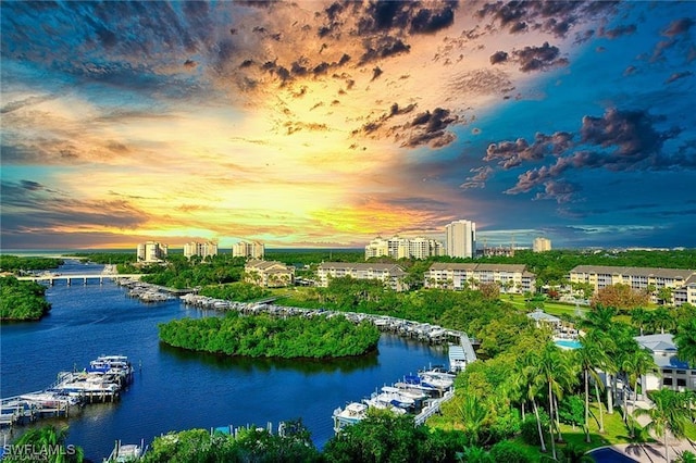 aerial view at dusk with a water view