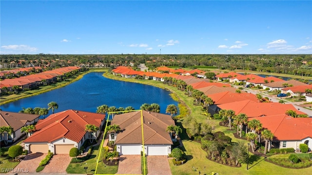 birds eye view of property featuring a water view