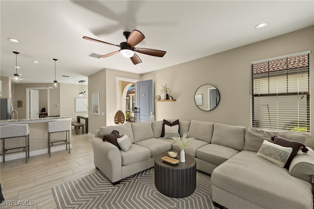 living room featuring ceiling fan