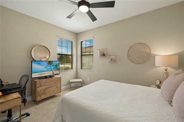 bedroom with light carpet and ceiling fan