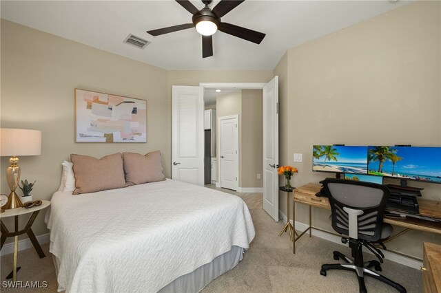 bedroom featuring ceiling fan and light colored carpet