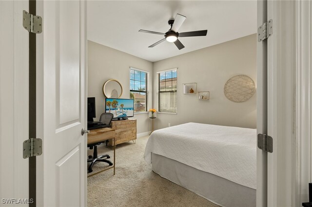 carpeted bedroom featuring ceiling fan