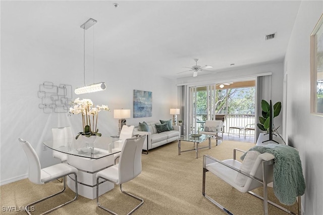 living room featuring ceiling fan and carpet flooring