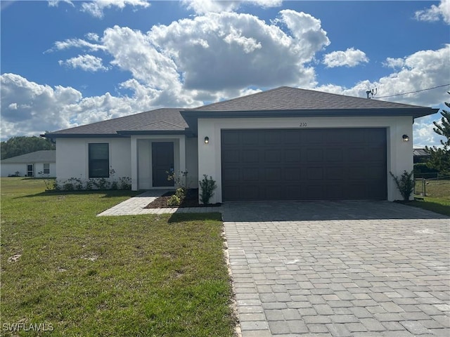 view of front facade featuring a garage and a front lawn