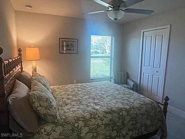 bedroom with ceiling fan and carpet flooring