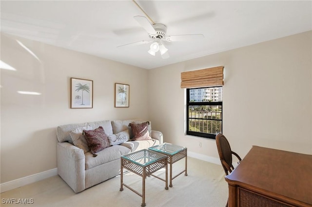 living room with light colored carpet and ceiling fan