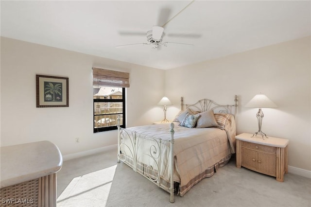 bedroom featuring ceiling fan and carpet flooring