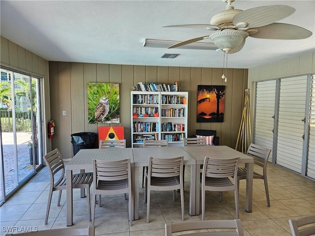 dining room featuring light tile patterned floors, a ceiling fan, and visible vents