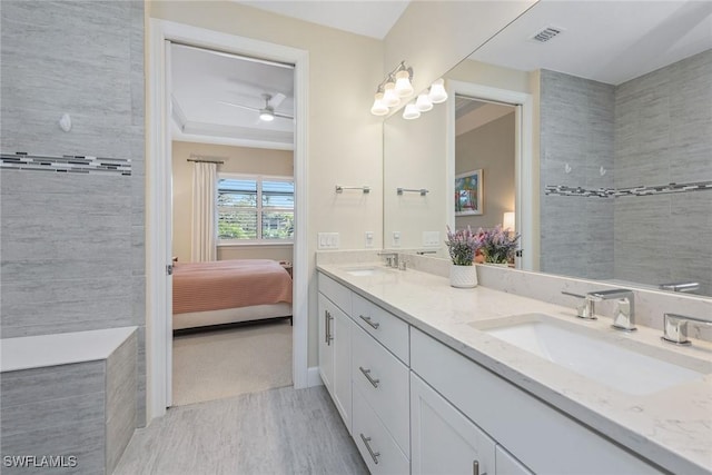 2720 Amaranda Ct, Naples, FL 34114 - bathroom featuring vanity, wood-type flooring, and ceiling fan