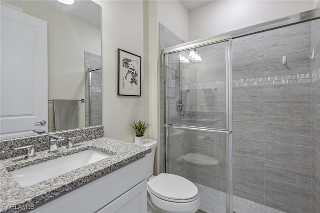 2720 Amaranda Ct, Naples, FL 34114 - bathroom with walk in shower, vanity, and toilet