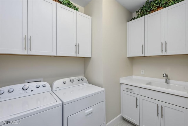 2720 Amaranda Ct, Naples, FL 34114 - washroom with separate washer and dryer, sink, and cabinets