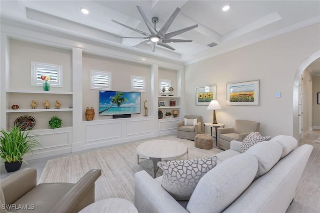 2720 Amaranda Ct, Naples, FL 34114 - living room featuring crown molding, built in shelves, coffered ceiling, and ceiling fan