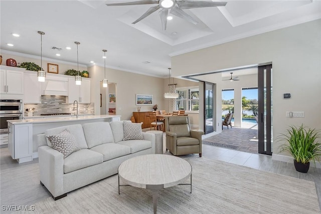 2720 Amaranda Ct, Naples, FL 34114 - living room featuring crown molding and ceiling fan