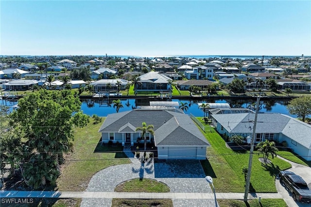 birds eye view of property with a water view