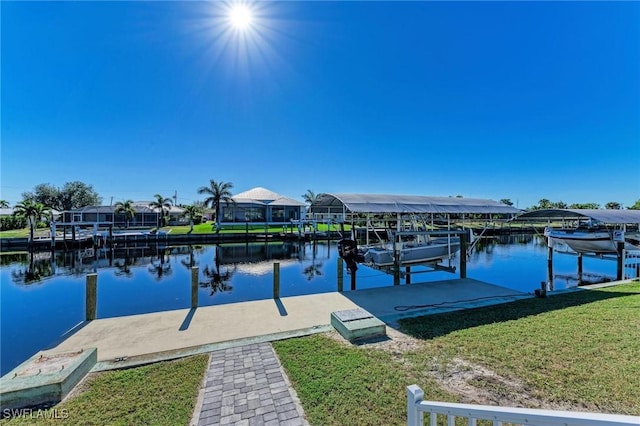 view of dock featuring a water view and a yard