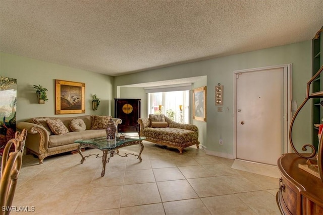 living area with light tile patterned floors and a textured ceiling