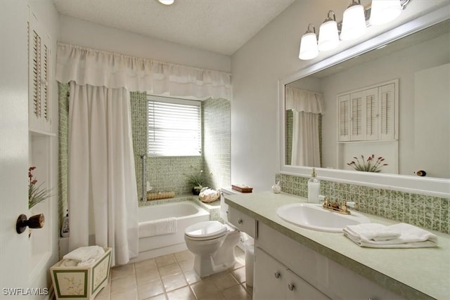 bathroom featuring tile patterned floors, toilet, a textured ceiling, decorative backsplash, and vanity