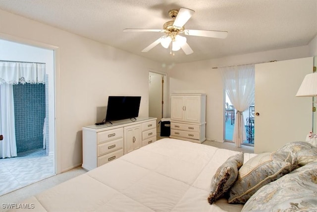 bedroom with a textured ceiling, access to exterior, ceiling fan, and light carpet