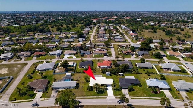 birds eye view of property with a residential view