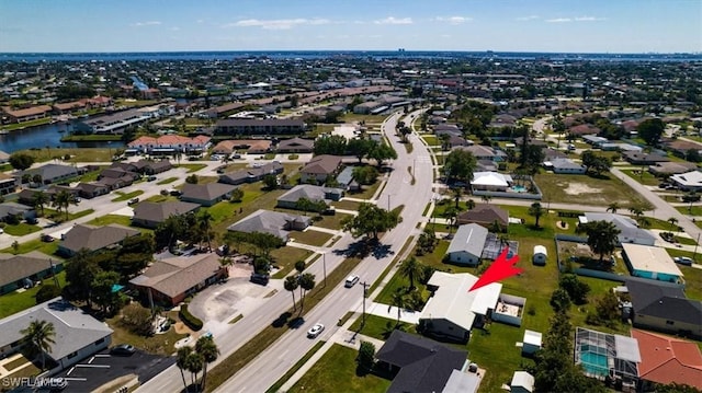 birds eye view of property with a residential view