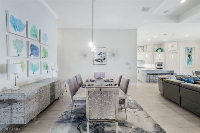 dining area with ornamental molding