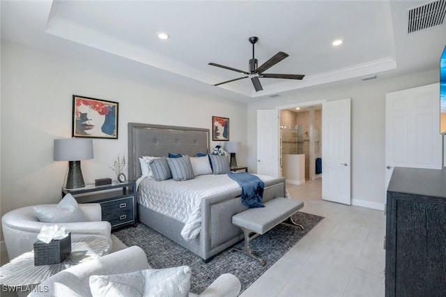 bedroom with ceiling fan and a tray ceiling