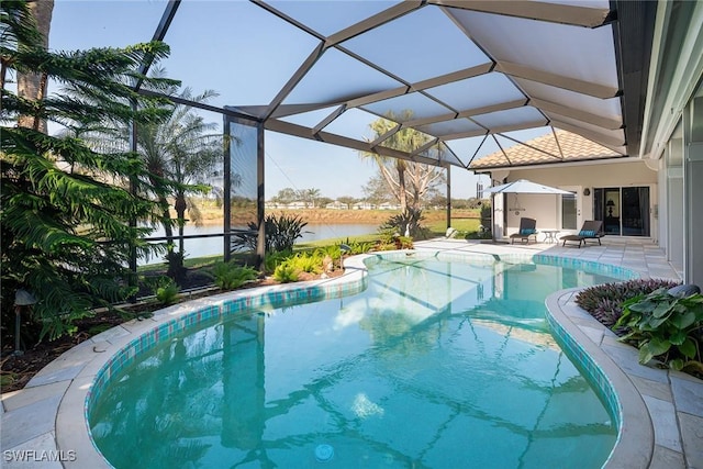 view of swimming pool featuring a water view, a patio area, and a lanai