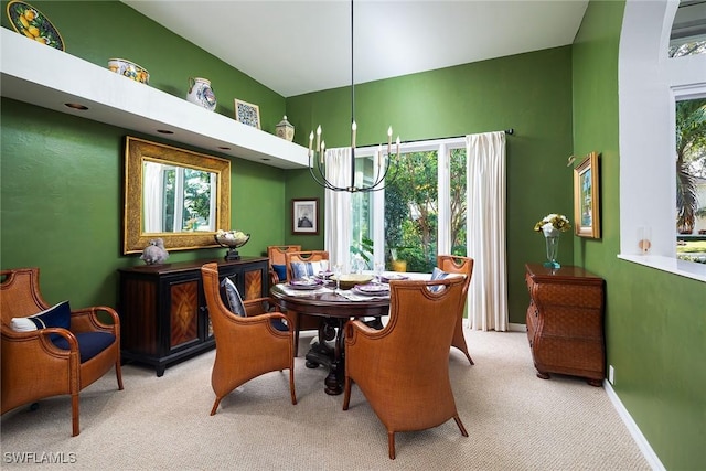 carpeted dining area with a notable chandelier