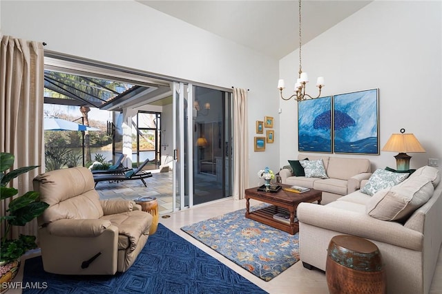 living room featuring vaulted ceiling and a chandelier