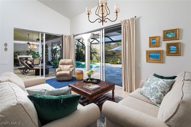 living room featuring lofted ceiling and a notable chandelier