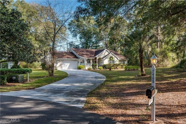 ranch-style home with a garage and a front yard