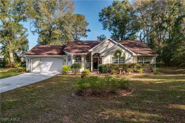 ranch-style house featuring a garage and a front yard