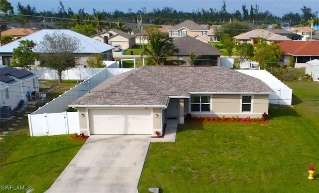 view of front of house featuring a garage and a front yard