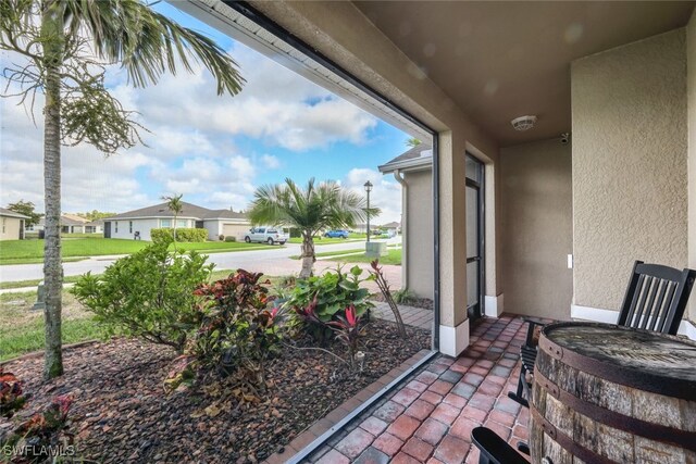 2628 Manzilla Ln, Cape Coral, FL 33909 - view of patio featuring a residential view