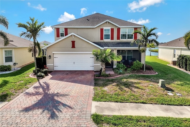 view of property featuring a front lawn