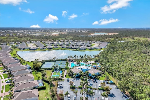 2628 Manzilla Ln, Cape Coral, FL 33909 - aerial view of property and surrounding area with nearby suburban area, a large body of water, and a pool area