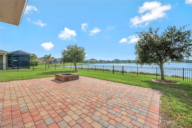 2628 Manzilla Ln, Cape Coral, FL 33909 - view of patio / terrace featuring a fire pit, a water view, and a residential view