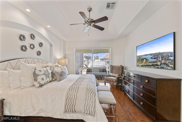 bedroom with ceiling fan, dark hardwood / wood-style floors, and access to outside