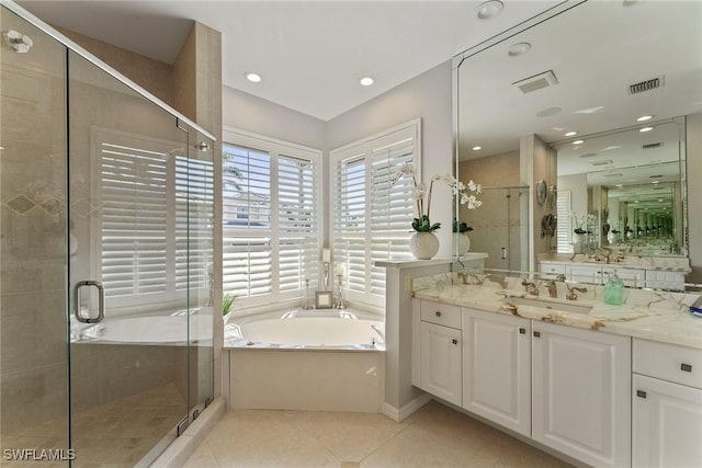 bathroom featuring tile patterned flooring, vanity, and independent shower and bath