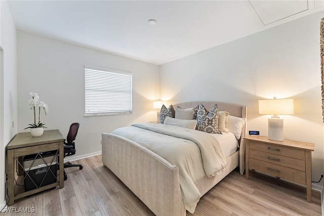 bedroom with light hardwood / wood-style floors